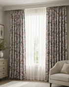 A pair of fully lined pencil pleat drapes in Sanderson 