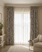 A pair of fully lined pencil pleat drapes in Sanderson 