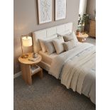 A pair of contemporary nightstands or accent tables, each featuring a solid circular oak top with an