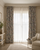 A pair of fully lined pencil pleat drapes in Sanderson 