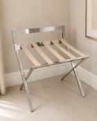 Mertnk folding luggage rack constructed from polished stainless steel, featuring a sturdy X-frame