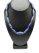 LAPIS CYLINDRICAL BEAD NECKLACE ACCENTED BY BRONZE BEADS AND TOGGLE CLASP