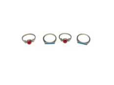 FOUR STERLING SILVER RINGS INCLUDING TWO WITH CORAL AND TWO WITH INLAID TURQUOISE