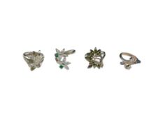 FOUR STERLING SILVER SIMULATED STONE AND COLORLESS CZ COCKTAIL RINGS