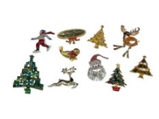 RHINESTONE AND ENAMEL CHRISTMAS BROOCHES INCLUDING BOTH SIGNED AND VINTAGE PIECES