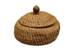 20TH CENTURY PAPAGO PINE NEEDLE AND SWEET GRASS COIL WEAVE COVERED BASKET WITH ACORN TOP