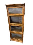 FOUR TIER BARRISTER / LAWYER STYLE OAK BOOKCASE WITH PORCELAIN KNOBS AND GLASS PANELS