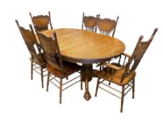 VINTAGE DARK STAINED OAK PEDESTAL CLAW FOOT DINING TABLE WITH SIX PRESSED BACK CHAIRS WITH LEAVES