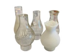 FIVE VINTAGE GLASS OIL LAMP CHIMNEYS INCLUDING MILK GLASS AND FROSTED GLASS