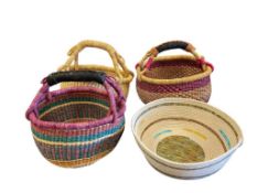 THREE AFRICAN BOLGA MARKET BASKETS WOVEN FROM ELEPHANT GRASS AND A HANDMADE BASKET BY MARY E