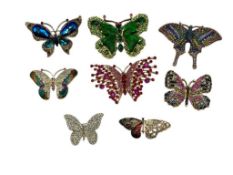EIGHT STUNNING BUTTERFLY BROOCHES FEATURING VIBRANT JEWELED DESIGNS AND GOLD TONES
