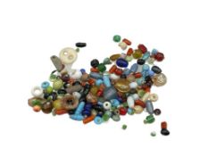 ANTIQUE NATIVE AMERICAN CORAL, COLORED GLASS, AND CARVED STONE BEADS