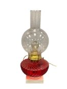 VINTAGE ELECTRIFIED RUBY RED REVERSE SWIRL GLASS OIL LAMP WITH MILK GLASS BASE