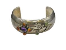 VINTAGE NAVAJO LORENZO SECATERO STERLING SILVER CUFF BRACELET FEATURING AMBER AND PERIDOT