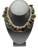 UNIQUE STERLING SILVER NECKLACE ADORNED WITH FACETED SMOKEY GLASS TEARDROPS