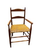 ANTIQUE WOOD ARMCHAIR WITH HAND WOVEN RUSH SEAT AND LADDER BACK