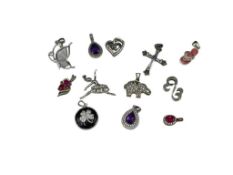 ASSORTED STERLING SILVER PENDANTS FEATURING MARCASITE DESIGNS, FIGURAL STYLES, AND MORE