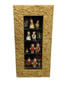 ANTIQUE GILT WOOD FRAMED FOLIATE DESIGN SHADOWBOX FRAME FEATURING ANTIQUE PORCELAIN DOLLS