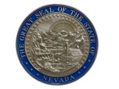 THE GREAT SEAL OF THE STATE OF NEVADA IN SILVER AND BLUE