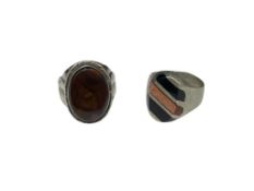 TWO VINTAGE STERLING SILVER RINGS INCLUDING ONE WITH BLACK ONYX AND SANDSTONE INLAID DESIGN