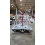 CONTAINMENT CHAMBER WITH MOTORIZED AGITATOR WITH MOVING CART