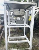 CONTROL AND METERING VIBRATING BULK BAG DISCHARGER