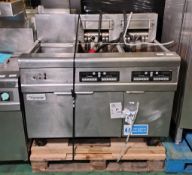 Frymaster FMRE217CSD (SN: 1406NI0008) 3 door stainless steel twin tank quad basket electric fryer