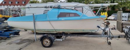 Skipper yacht with sail and Evinrude engine store in the hull comes with trailer - see description