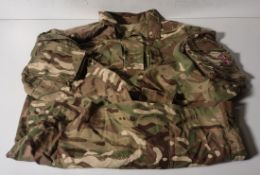 Various types of ex-military camo clothing - may include accessories - 167kg – may require repair