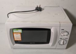 Box containing 12x standard home or workplace use microwaves, brands including Igenix and Currys