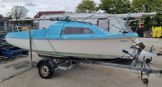Skipper yacht with sail and Evinrude engine store in the hull comes with trailer - see description