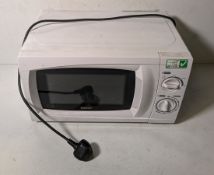 Box containing 12x standard home or workplace use microwaves, brands including Igenix and Currys