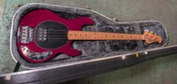 Ernie Ball Music Man StingRay red bass guitar in black Hiscox Liteflite The Bass Centre case