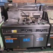 Frymaster FMRE217CSD (SN: 1310NI0007) stainless steel twin tank quad basket electric fryer with dump