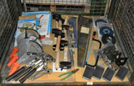 Mixed tools - saws, cutters, pliers, hammers, wrenches, wheel chocks and measuring tapes