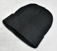 2x boxes of black beanie hats - approx. 200 per box