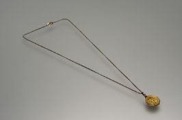 An Italian 18ct gold octagonal Madonna pendant: d. x 1.5cm on 18ct gold chain with ring fastening: