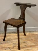 A 20th century inalid hardwood chair, by M.I. Hayat of Lahore, with brass inlaid back and supports