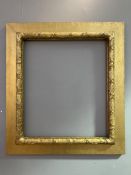 A late 19th century Arts and Crafts giltwood picture frame, with leaf design: Opening H. 58cm L.