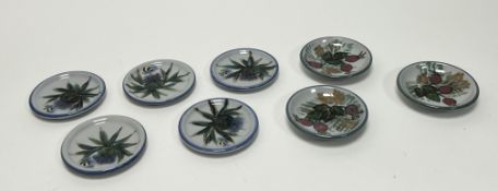 A collection of eight Highland Stoneware trinket dishes comprising five decorated with thistles