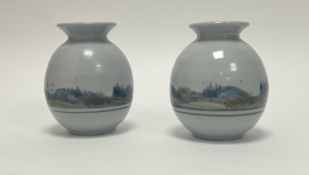 A pair of Highland Stoneware vases of squat form, decorated with hand-painted Scottish landscape