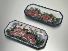 A pair of three Highland Stoneware platters of octagonal form, decorated with poppies and thistles