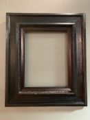 A 19th century Continental, possibly Dutch, picture frame: Opening H. 34cm L. 27cm