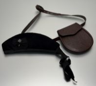 A brown leather day sporran with waist belt (19.5cm x 18cm) and a black glengarry (size 58)