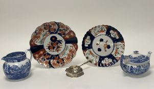 A 19th Century Japanese Imari plate with hand-painted panels and impressed mark to base (d. 22cm) (