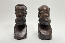 A pair of 20th Century African hand carved wooden busts (h. 20cm) (2)