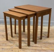A mid-century teak nest of tables, rectangular tops raised on square supports: H. 54cm L. 53cm D.