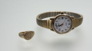 A 9ct gold signet ring with engraved leaf M 1.46g and a Timex quartz gilt wristwatch on an expanding