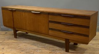 A good mid-century teak sideboard, rectangular top over three drawers, central fall-front bar