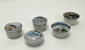 A collection of five Highland Stoneware lidded trinket dishes, each handpainted with seascapes and